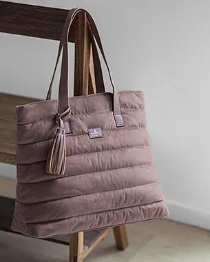 A puffer tote bag featuring the Benjamin Moore Color of the Year 2025, Cinnamon Slate 2113-40.