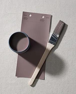 A paint brush, paint swatch and paint sample of Cinnamon Slate 2113-40.